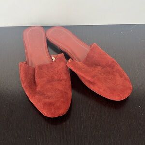 Well worn Red faux-suede slip on flats